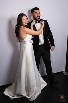 A photo preview on the Mirror Me of a Bride and Groom with their guest at a wedding